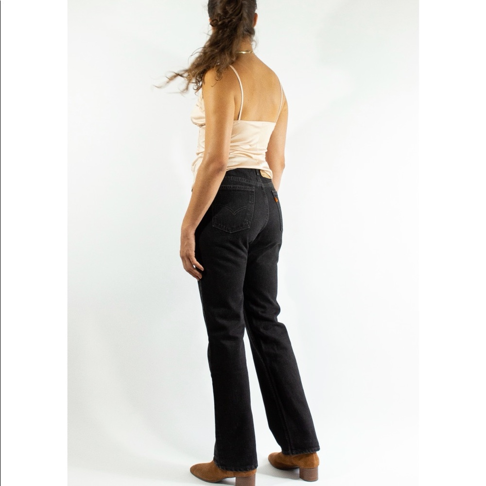 Orange tab 575 Levi’s jeans.